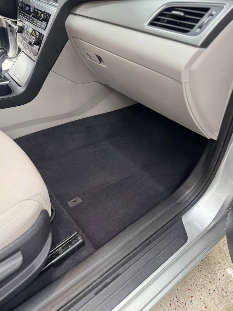 The after photo of the clean floor mats of a vehicle after a car detailing appointment at Clean Car Wash and Detail in Fredericksburg, VA.
