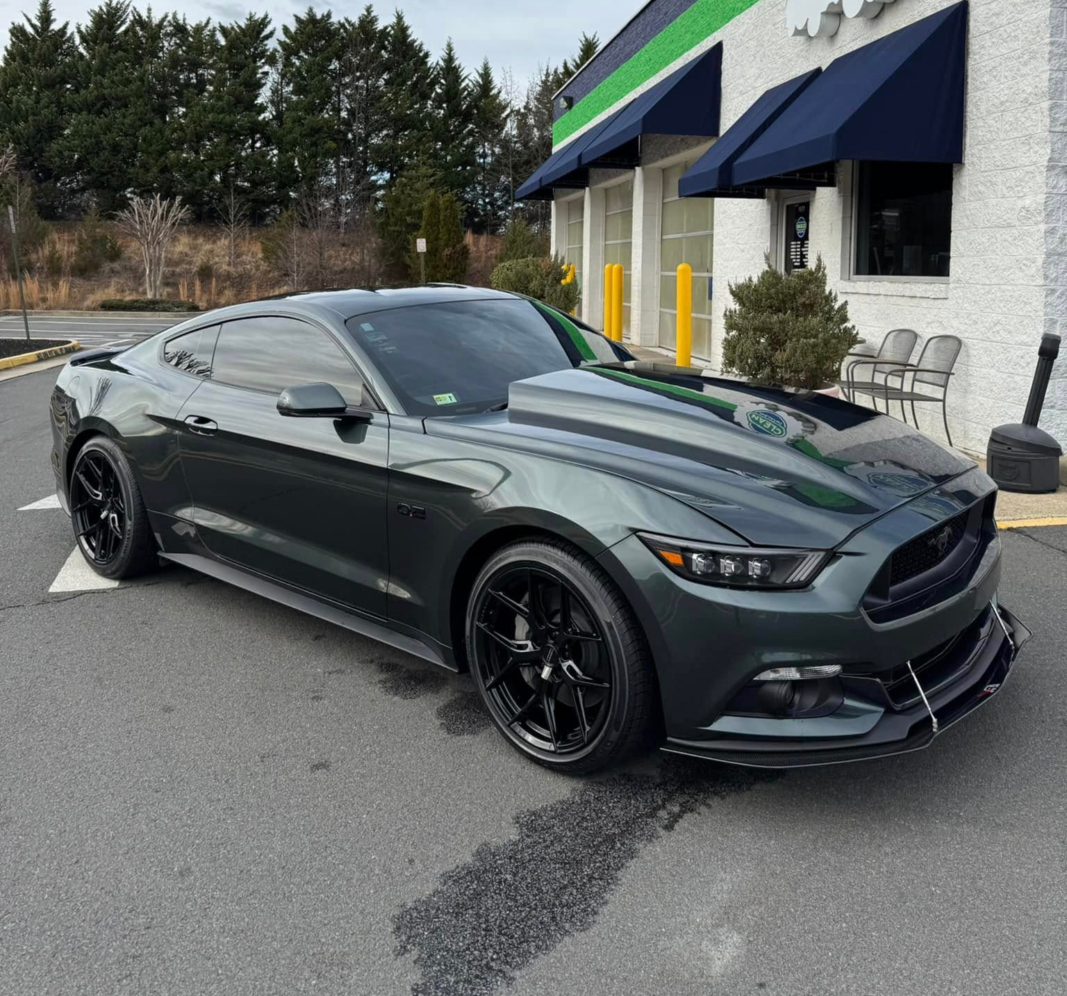 A grey sports car that just received ceramic coating services at Clean Car Wash and Detail in Fredericksburg, VA.