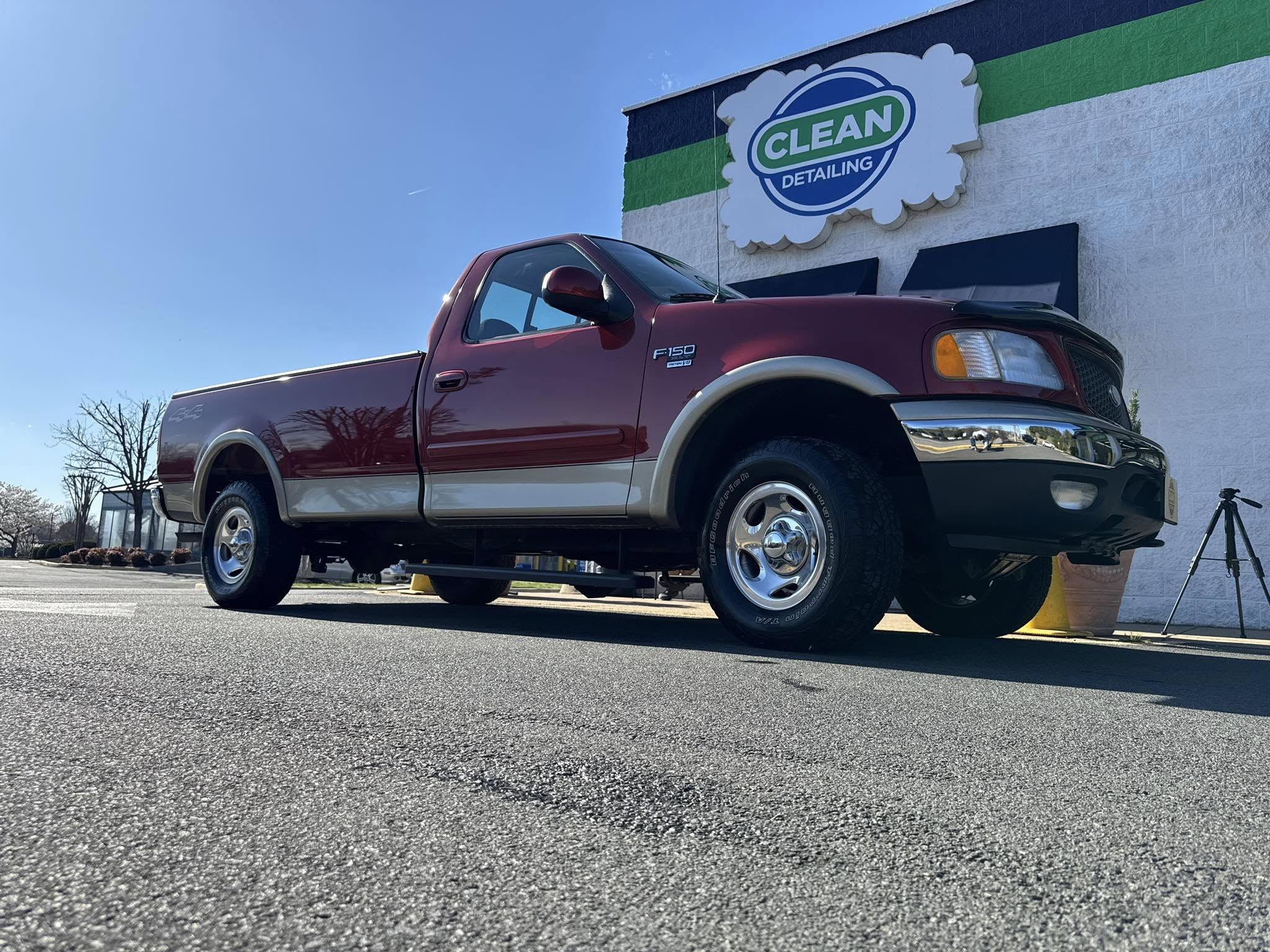 A red pickup truck that just received paint correction services at Clean Car Wash and Detail in Fredericksburg, VA.