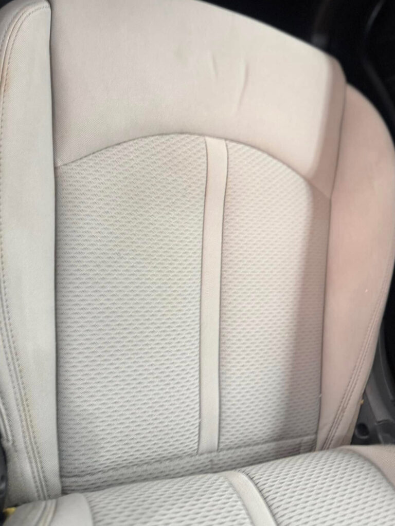 The after photo of the clean seat of a vehicle after a car detailing appointment at Clean Car Wash and Detail in Fredericksburg, VA.
