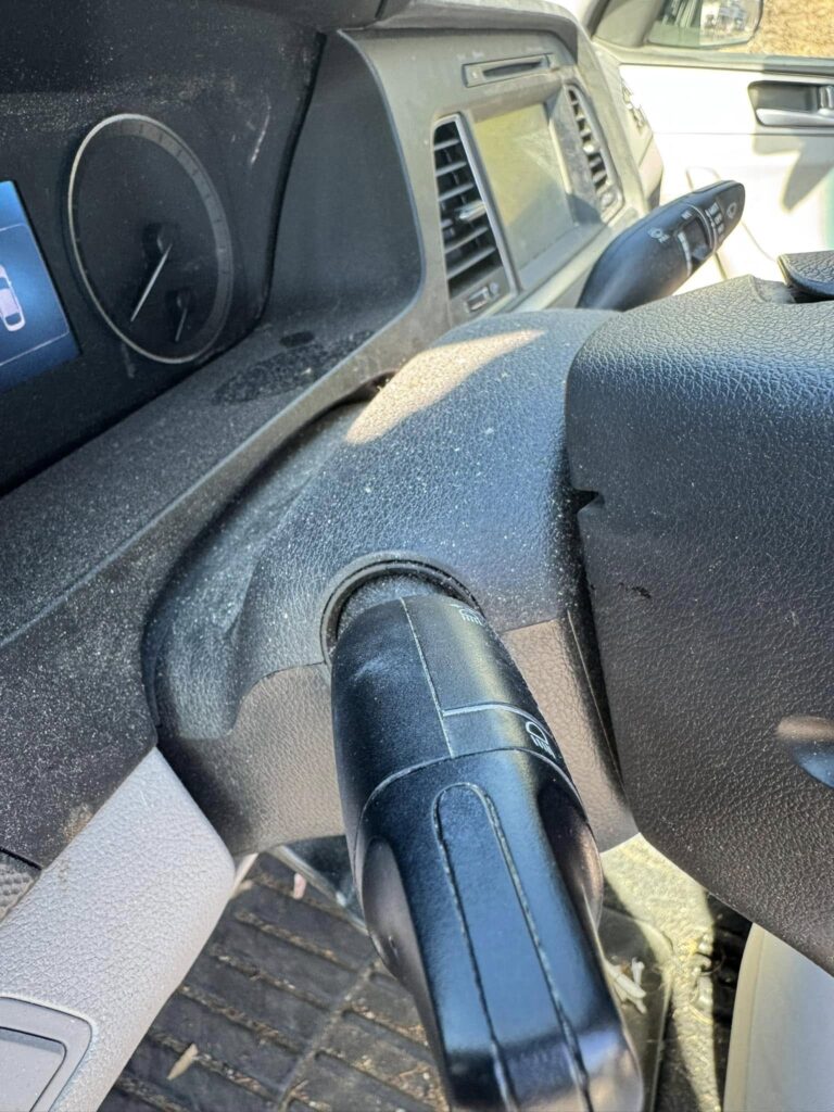 A photo of a dusty, dirty car steering wheel before a car detailing appointment at Clean Car Wash and Detail in Fredericksburg, VA.