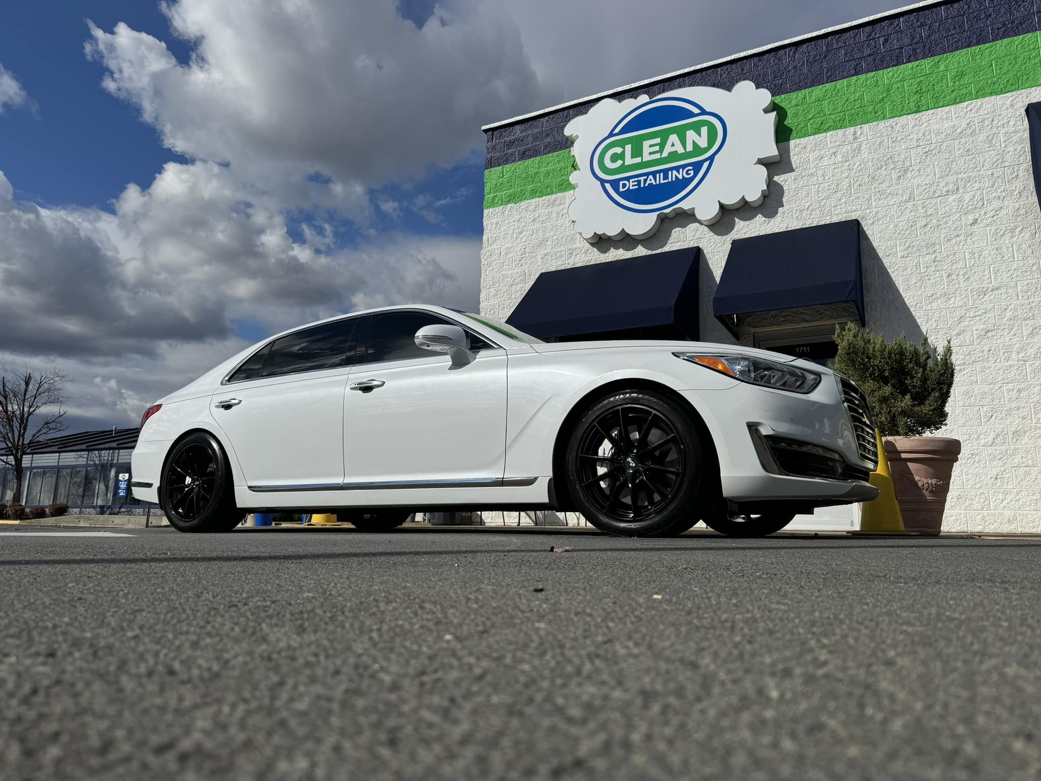 A photo of a white sports car that received ceramic coating at Clean Car Wash and Detail in Fredericksburg, VA.