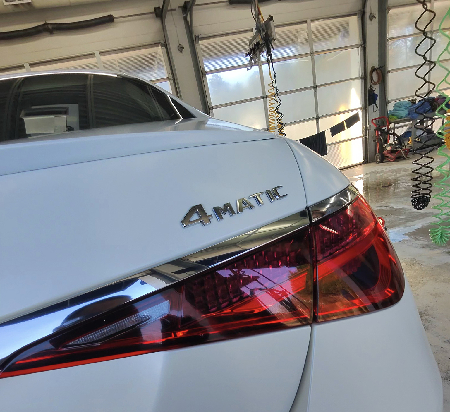 A close up of a white car that just finished its ceramic coating appointment at Clean Car Wash and Detail in Fredericksburg, VA.
